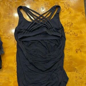 Lululemon size 8 black tank with built in bra. Low back. Lots of compliments